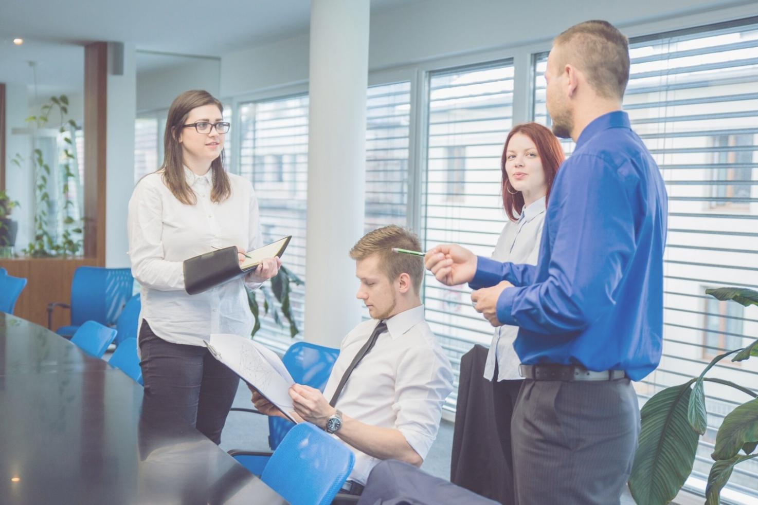 Business professionals analyzing financial data and market trends